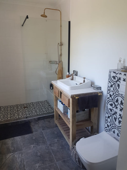 A Touch of Timeless Luxury: Vintage Basin with Solid Brass Basin Taps and Solid Brass Shower with Hand Shower and Solid brass Towel Rail